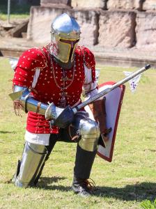knight in red armour kneeling